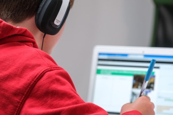 A student attending a live online lesson from home